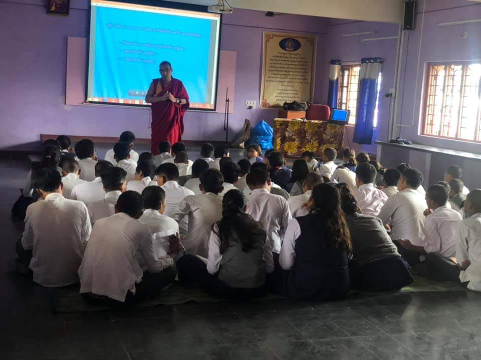 DoE mentor on Secular Ethics, Geshe Lharampa Yeshi Gyaltsen talking to a group of children from Tibetan schools in South India