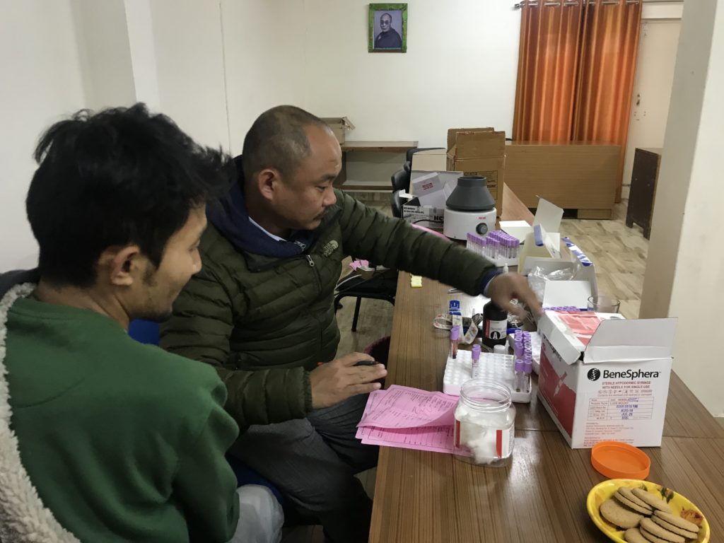 Lab Technicians from Delek hospital conducting Hep B screening, taking blood sample of CTA staff at Kashag Office. Photo/ Department of Health