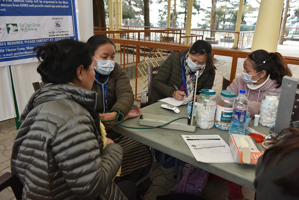 Nurses taking readings of visitors at the free health camp. Photo/ Tenzin Phende/ CTA