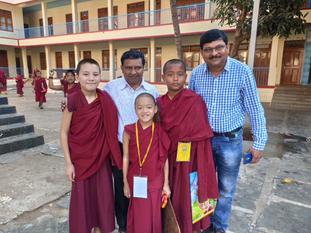 Two members of the group with small monks. Photo/ ITCO, Delhi