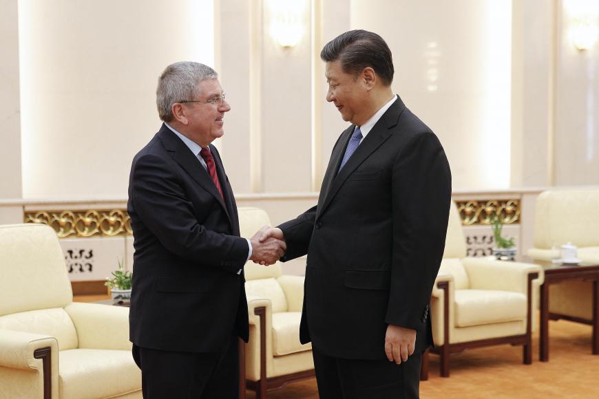International Olympic Committee President Thomas Bach (left) shakes hands with Chinese President Xi Jinping before proceeding to their meeting at the Great Hall of the People in Beijing, China, January 31, 2019. © 2019 AP Photo/Andy Wong, Pool