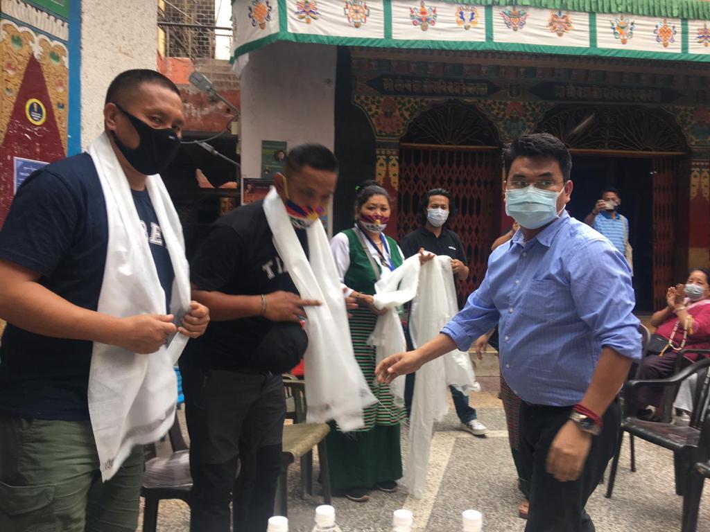 Mr. Phuntsok Topgyal offering Khatak to Tibetan peace marchers at their reception in Samyeling Tibetan settlement, Delhi. 
