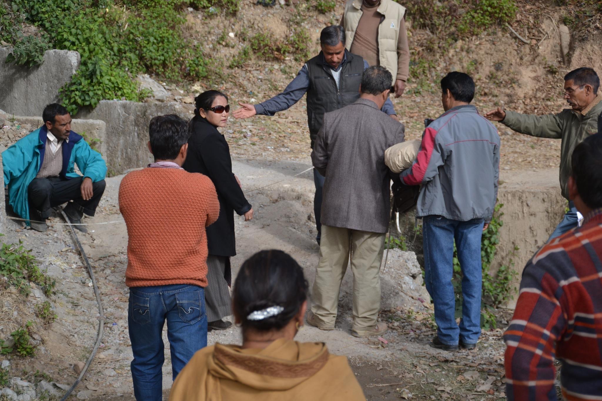 Mrs. Karma Dolma, as an officer of CTA's land revenue, carrying out the demarcation of CTA's land boundary below the Nechung Monastery in Dharamshala, HP, India, in 2012. 