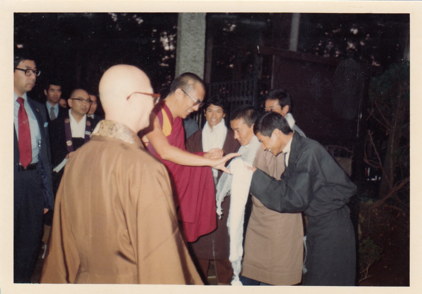 Tibetan students including Mr. Tsering Dorjee welcoming His Holiness the 14th Dalai Lama upon his arrival at Chiba Ken Agriculture College in Japan. 